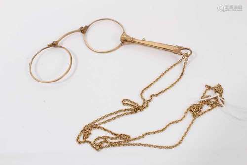 Antique gilt metal lorgnette on a yellow metal chain