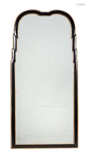 An ebonised and parcel gilt wall mirror