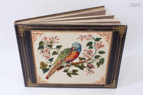 A 19th Century leather and tapestry mounted album containing...
