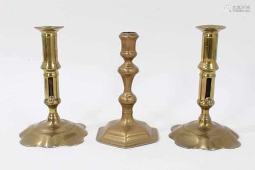 Pair of brass early 18th century candlesticks with shaped ba...