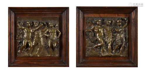 A pair of Italian bronze plaques of Bacchic putti