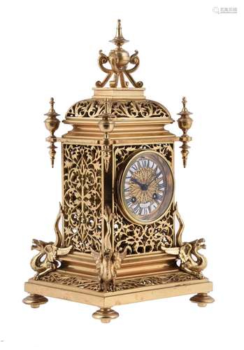 A gilt metal mantel clock