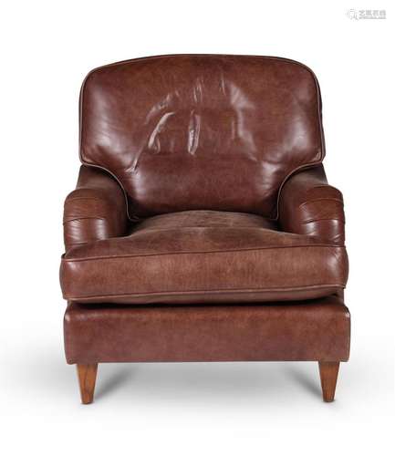 A leather upholstered armchair