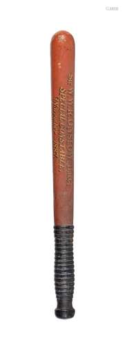 A mid Victorian red and black painted wood truncheon