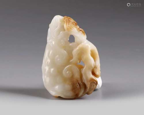 A CHINESE WHITE AND RUSSET JADE 'BAT AND LINGZHI'