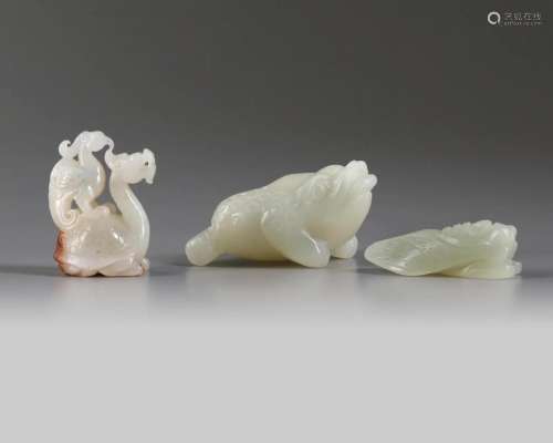 A GROUP OF CHINESE WHITE AND PALE CELADON JADE MYTHICAL