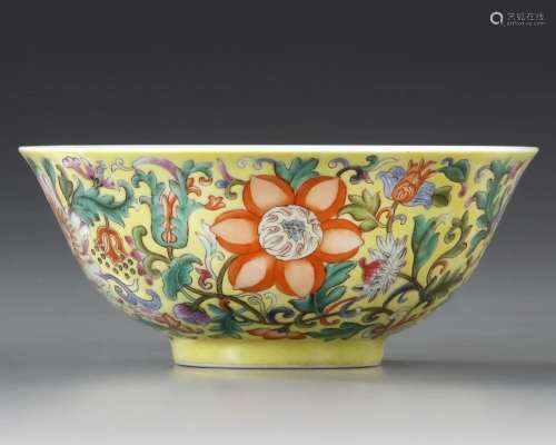 A CHINESE FAMILLE ROSE YELLOW-GROUND 'BLOSSOMS' BOWL...
