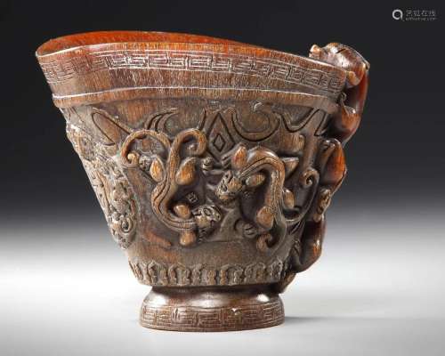A CHINESE CARVED BUFFALO HORN LIBATION CUP, 19TH