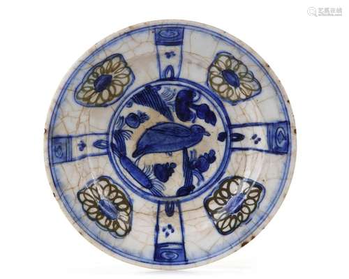 A KUBACHI UNDERGLAZE-PAINTED POTTERY DISH, PERSIA, 17TH