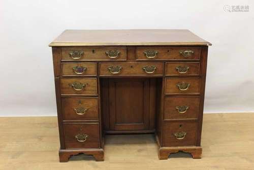 George III mahogany kneehole estate desk, with eleven drawer...