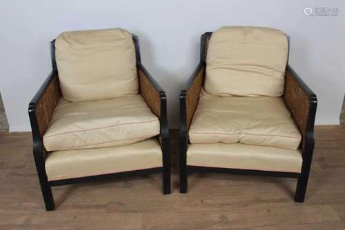 Pair of ebonised bergère chairs