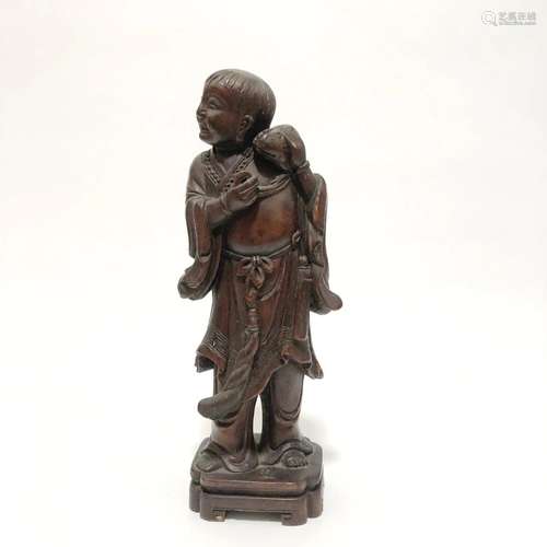 A Carved Wooden Figurine