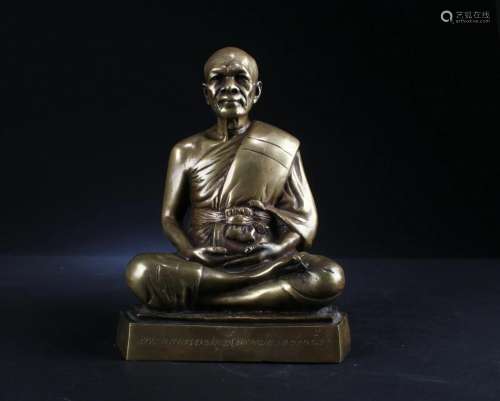 A Bronze Seated Monk Statue