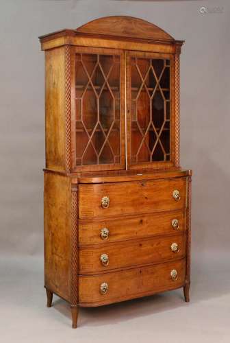 A George IV mahogany secretaire bookcase cabinet, the arched...