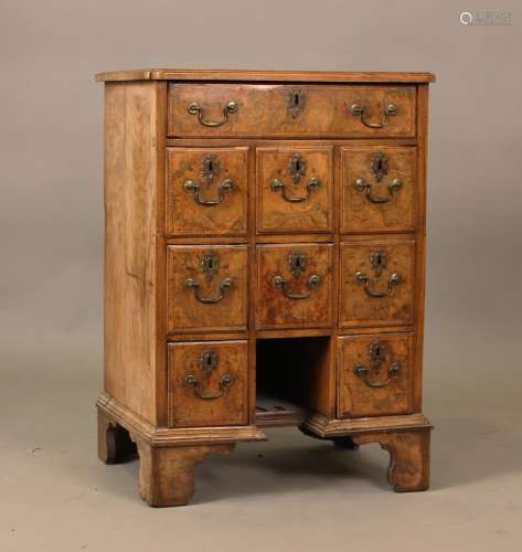 A George I style burr walnut and crossbanded chest, fitted w...
