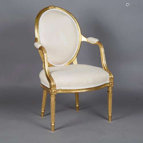 A late 18th century giltwood showframe armchair, the oval ba...