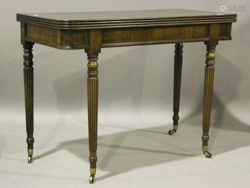 A William IV mahogany fold-over tea table with a reeded edge...