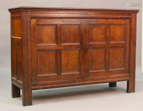 A late 18th/19th century provincial oak cupboard, the dentil...