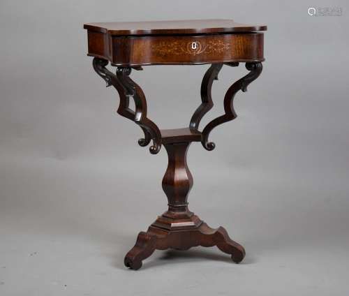 A mid-19th century rosewood and inlaid work table, the hinge...