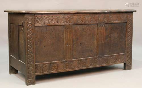 A Victorian oak and elm panelled coffer, the front with inse...