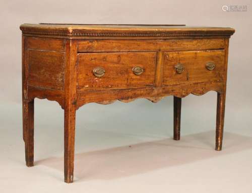 An 18th century provincial elm dresser base, fitted with two...