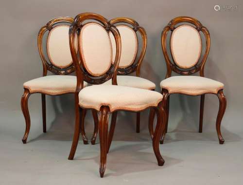 A set of four mid-Victorian rosewood framed spoon back dinin...