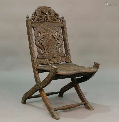 A South-east Asian carved folding chair, probably late 19th ...