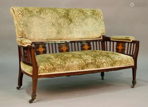 An Edwardian mahogany two-seat salon settee, the five back s...