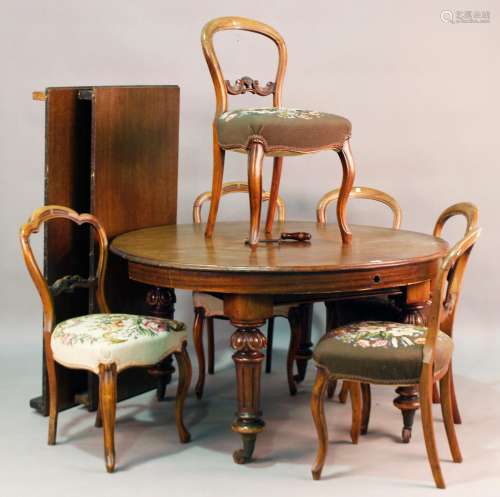 A Victorian and later mahogany extending dining table, the t...