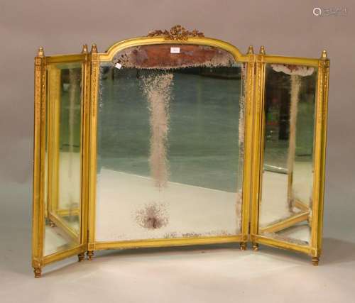 An Edwardian gilt composition triptych dressing table mirror...