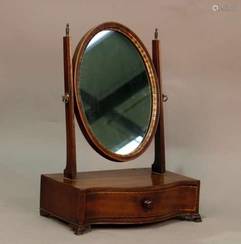 A 19th century mahogany swing frame mirror, the serpentine b...