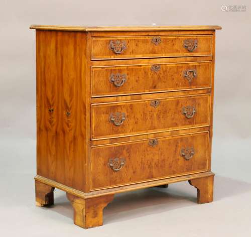 A late 20th century reproduction yew and crossbanded chest o...