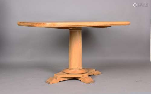 A modern oak centre table by Mark Wilkinson, raised on a qua...