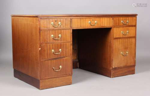 A mid-20th century mahogany twin pedestal desk, the top inse...