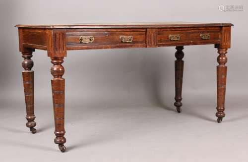 A late Victorian mahogany library table, the top inset with ...