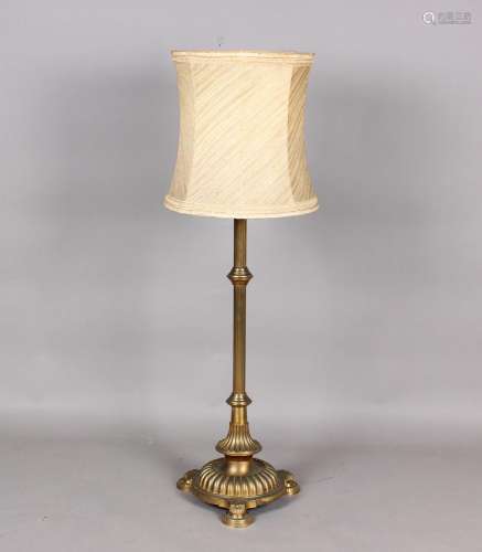 A late Victorian brass telescopic lamp standard, raised on a...