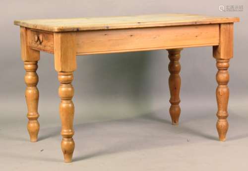 A 20th century Victorian style pine kitchen table, fitted wi...