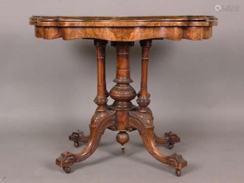 A mid-Victorian burr walnut fold-over card table with boxwoo...