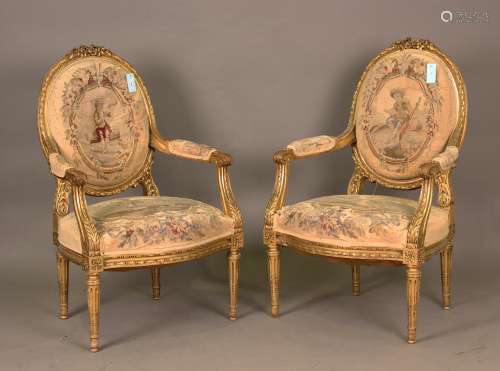 A pair of late 19th century Louis XVI style giltwood fauteui...