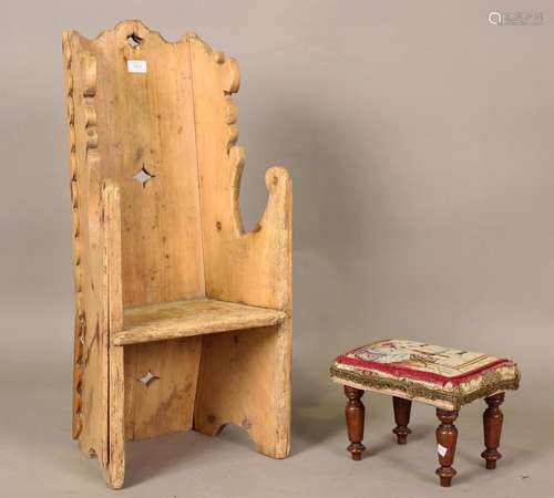 A 19th century pine childs chair of boarded form with shaped...