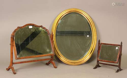 A 20th century Queen Anne style walnut swing frame mirror, h...