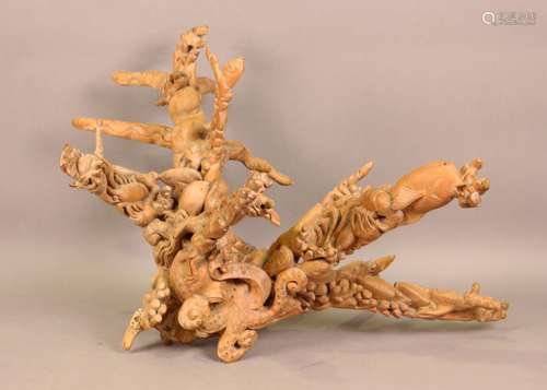 A late 20th century Balinese root carving of an octopus, fis...