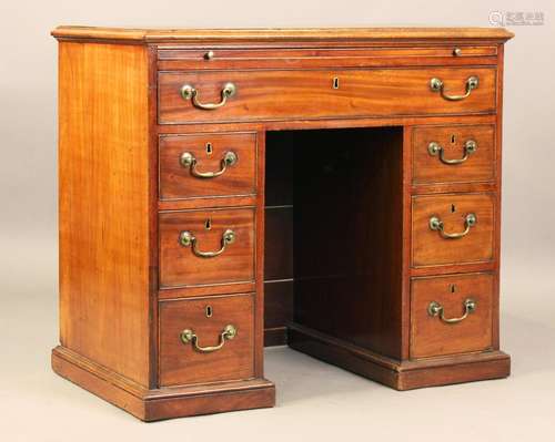 A George III mahogany kneehole desk, fitted with a brushing ...