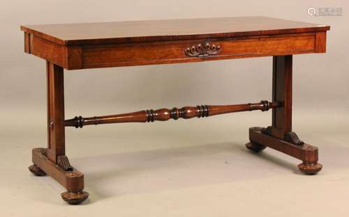 A Regency rosewood library table, the frieze fitted with two...