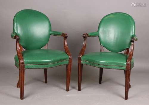 A pair of George III style mahogany library armchairs, uphol...