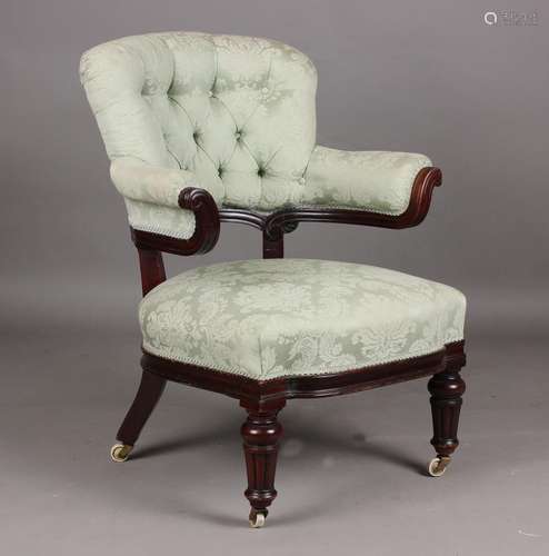 A mid-Victorian mahogany framed armchair, probably by Hollan...