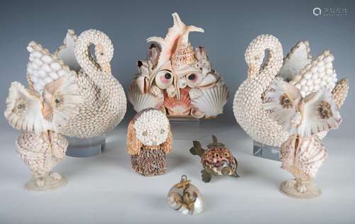 A group of sea shell encrusted ornaments, including a brass ...