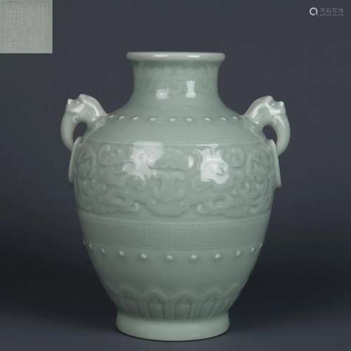 A Celadon Glazed Jar with Double Handles