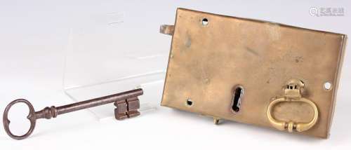 An early 19th century brass door lock with internal mechanis...