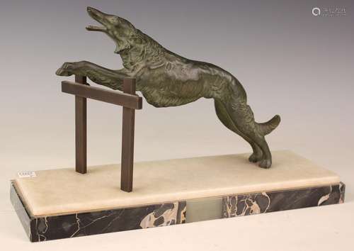 An Art Deco green patinated cast bronze model of a saluki ju...